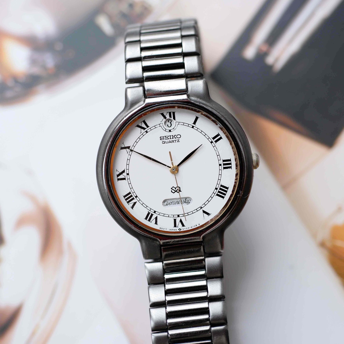 Vintage Seiko Dress Watch Black Coated White Roman Dial from the 80s