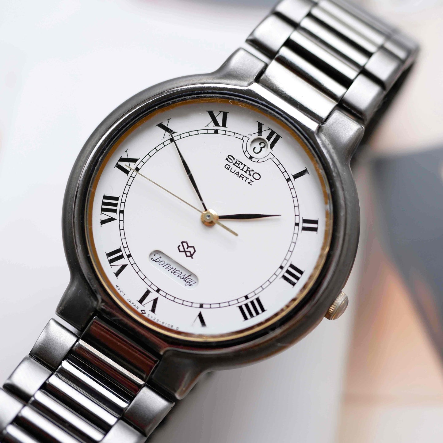 Vintage Seiko Dress Watch Black Coated White Roman Dial from the 80s