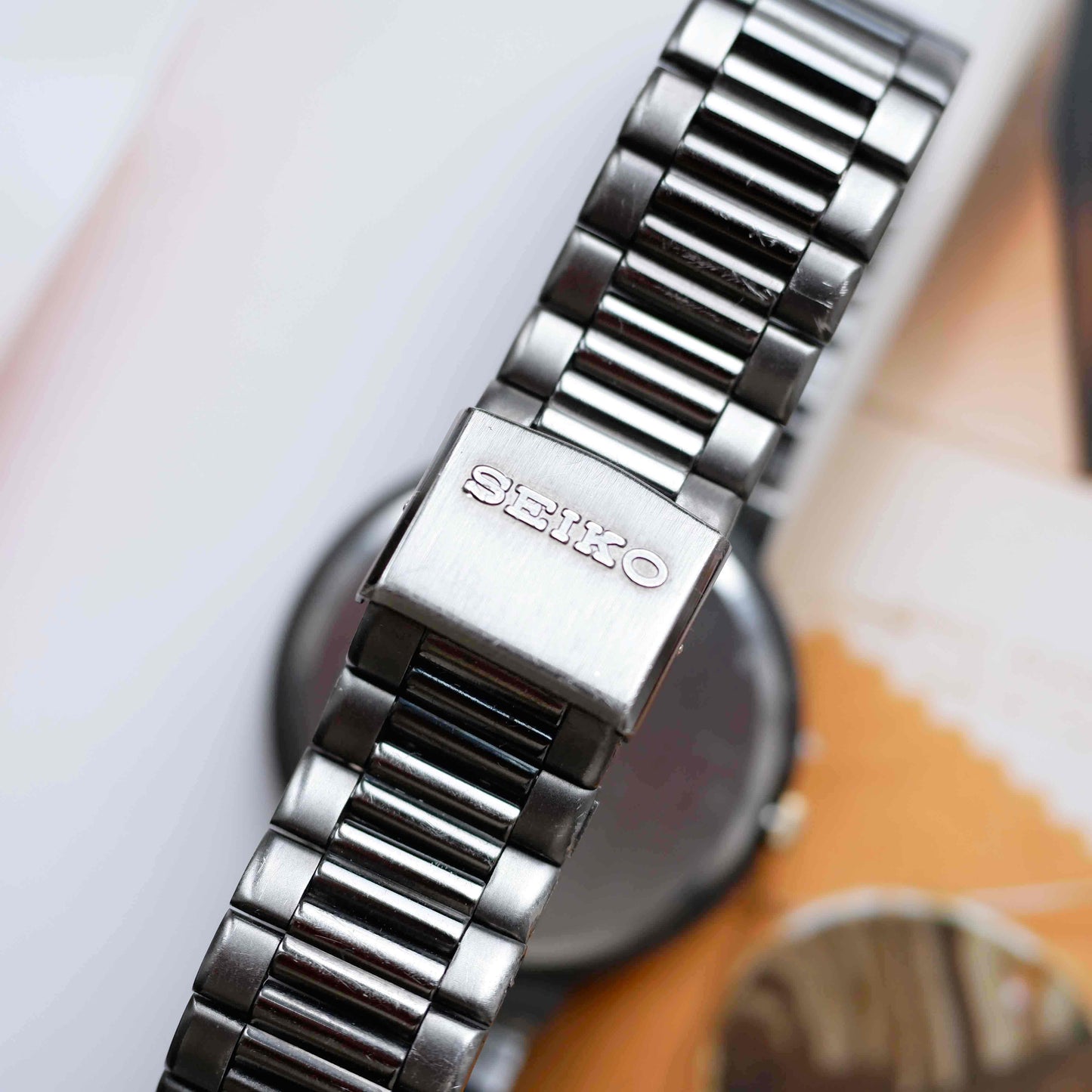 Vintage Seiko Dress Watch Black Coated White Roman Dial from the 80s