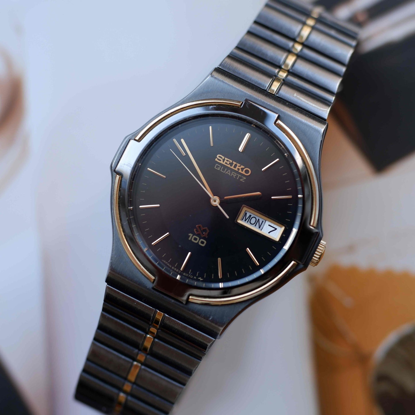 Vintage Seiko SQ100 Day and Date Quartz Black and Gold from the 80s