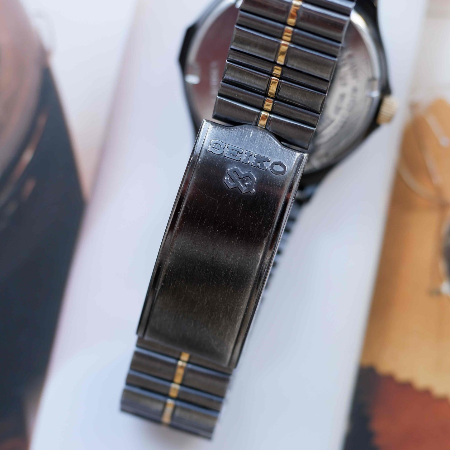 Vintage Seiko SQ100 Day and Date Quartz Black and Gold from the 80s