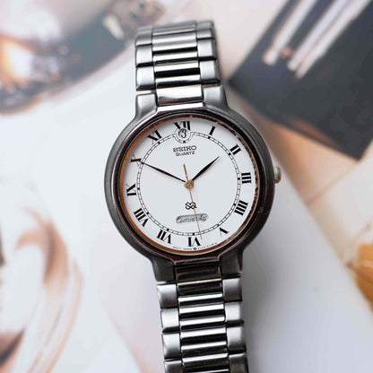 Vintage Seiko Dress Watch Black Coated White Roman Dial from the 80s