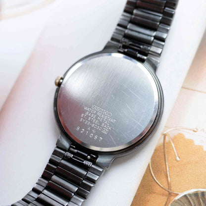 Vintage Seiko Dress Watch Black Coated White Roman Dial from the 80s
