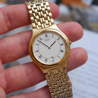 Vintage Seiko Quartz Date 90s with White Roman Dial Integrated Bracelet - MINT