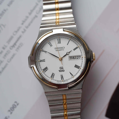 Vintage Seiko SQ100 Day and Date Quartz Two Tone Gold from the 80s
